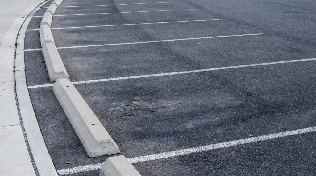 The Pros and Cons of Adding Curb Stops to Your Lot